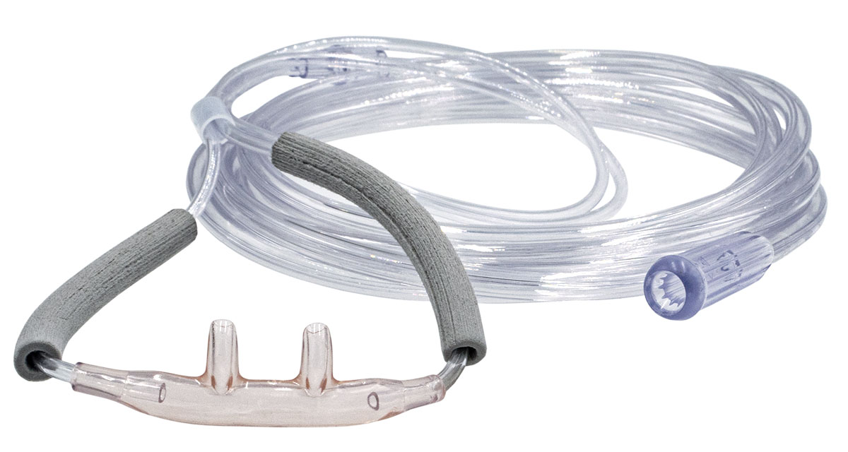 Transparent näsluftslang med anslutna rör och skumkuddar, används för att leverera syre till patienter.