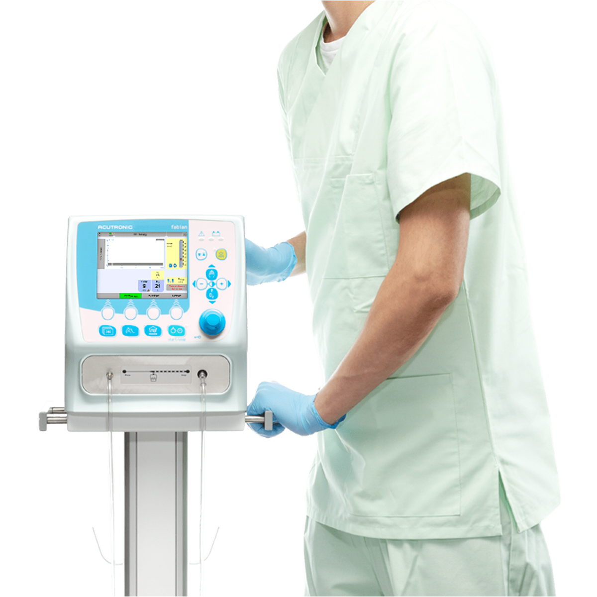 Sjukvårdspersonal i ljusgrön uniform justerar en medicinsk ventilator med blå handskar.